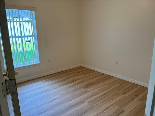 7714 Tanbier Dr, Orlando, FL 32818 - empty room with light wood-style flooring