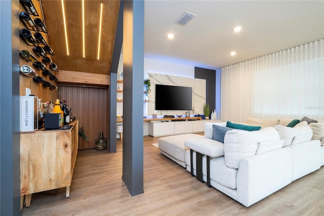 2813 Sanctuary Dr, Clermont, FL 34714 - living room with light wood-style floors, a dry bar, and recessed lighting