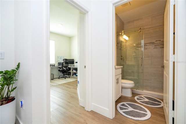 2813 Sanctuary Dr, Clermont, FL 34714 - bathroom with a shower stall and wood finished floors