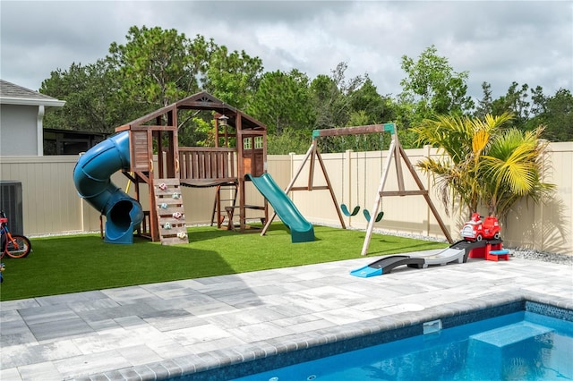 2813 Sanctuary Dr, Clermont, FL 34714 - view of playground with a fenced backyard and a patio
