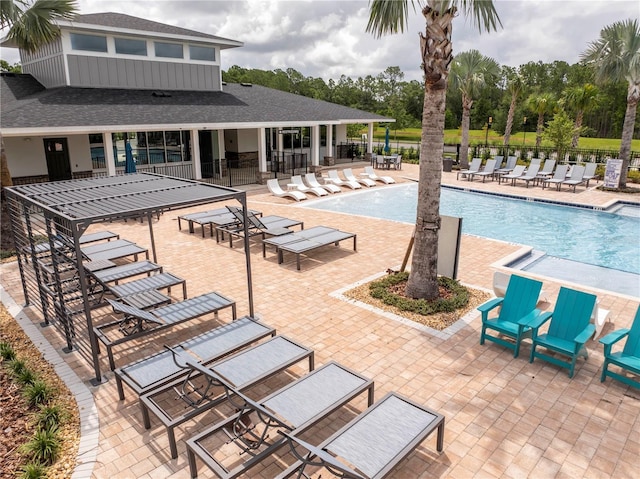 2813 Sanctuary Dr, Clermont, FL 34714 - community pool with a patio and view of wooded area