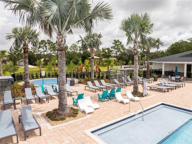 2813 Sanctuary Dr, Clermont, FL 34714 - community pool featuring a patio area