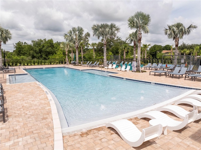 2813 Sanctuary Dr, Clermont, FL 34714 - community pool with a patio and view of scattered trees