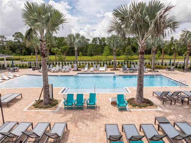 2813 Sanctuary Dr, Clermont, FL 34714 - community pool featuring view of wooded area and a patio