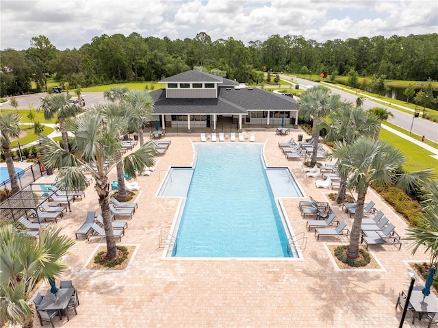 2813 Sanctuary Dr, Clermont, FL 34714 - community pool with a patio and view of scattered trees
