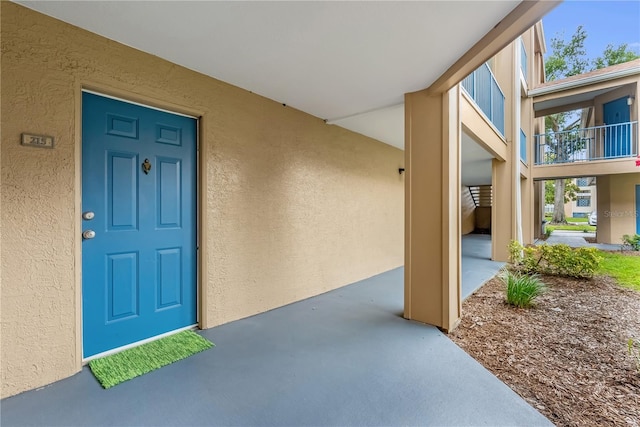 7350 Westpointe Blvd Unit 215, Orlando, FL 32835 - view of exterior entry featuring stucco siding