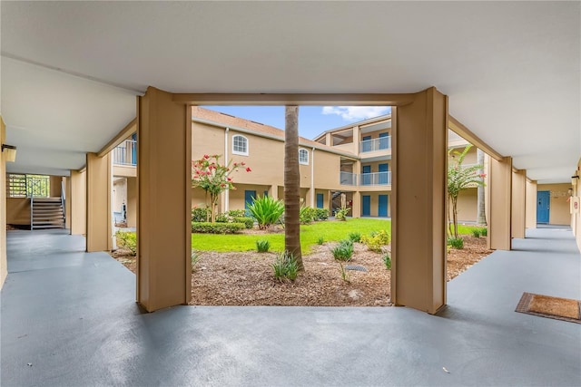 7350 Westpointe Blvd Unit 215, Orlando, FL 32835 - doorway to outside with plenty of natural light and finished concrete flooring