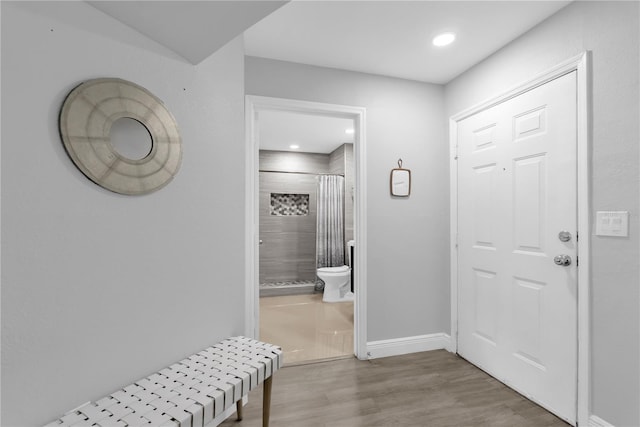 7350 Westpointe Blvd Unit 215, Orlando, FL 32835 - entryway featuring wood finished floors and recessed lighting