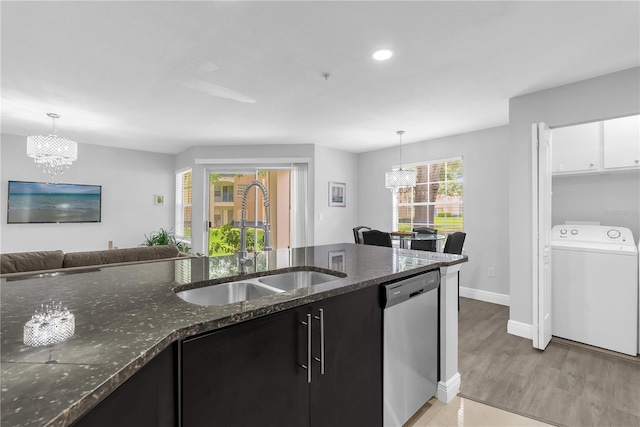 7350 Westpointe Blvd Unit 215, Orlando, FL 32835 - kitchen featuring washer / clothes dryer, dishwasher, a chandelier, dark cabinetry, and recessed lighting