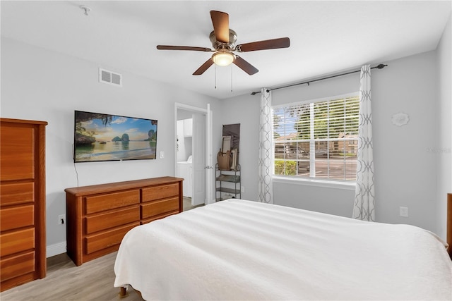 7350 Westpointe Blvd Unit 215, Orlando, FL 32835 - bedroom featuring light wood-type flooring and ceiling fan