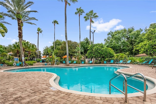 7350 Westpointe Blvd Unit 215, Orlando, FL 32835 - community pool featuring a patio