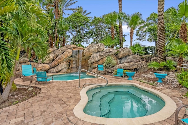 7350 Westpointe Blvd Unit 215, Orlando, FL 32835 - outdoor pool with a patio area