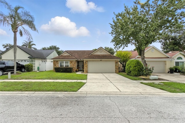 669 Whitetail Loop, Apopka, FL 32703 - single story home with a garage, concrete driveway, and stone siding