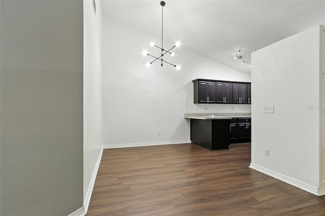 669 Whitetail Loop, Apopka, FL 32703 - kitchen with a chandelier, dark wood-type flooring, light countertops, high vaulted ceiling, and a peninsula