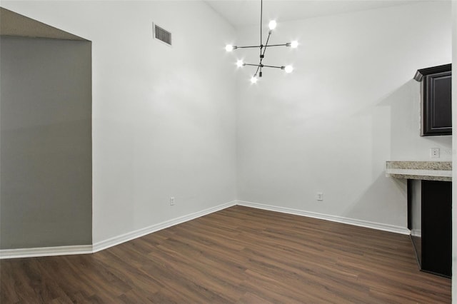 669 Whitetail Loop, Apopka, FL 32703 - unfurnished dining area with a chandelier and dark wood finished floors