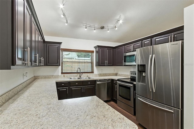 669 Whitetail Loop, Apopka, FL 32703 - kitchen featuring appliances with stainless steel finishes, dark brown cabinetry, and a peninsula