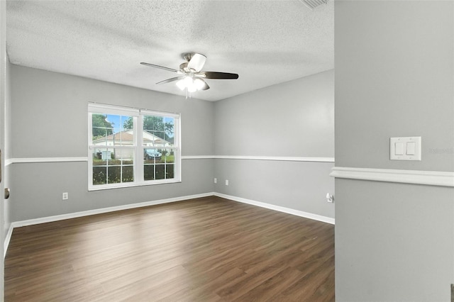 669 Whitetail Loop, Apopka, FL 32703 - spare room with ceiling fan, a textured ceiling, and dark wood-type flooring