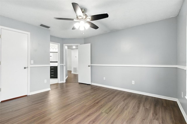 669 Whitetail Loop, Apopka, FL 32703 - unfurnished bedroom featuring dark wood finished floors and a ceiling fan