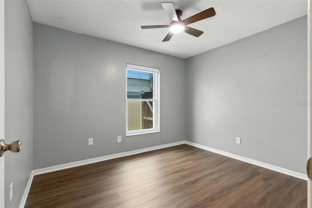 669 Whitetail Loop, Apopka, FL 32703 - unfurnished room featuring dark wood-style floors, a ceiling fan, and a textured ceiling