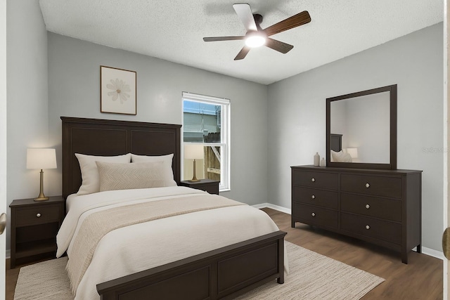 669 Whitetail Loop, Apopka, FL 32703 - bedroom featuring wood finished floors, ceiling fan, and a textured ceiling