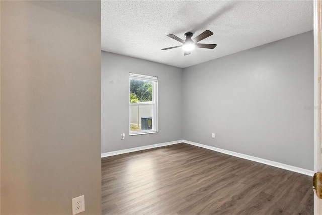 669 Whitetail Loop, Apopka, FL 32703 - spare room featuring ceiling fan, dark wood-style floors, and a textured ceiling