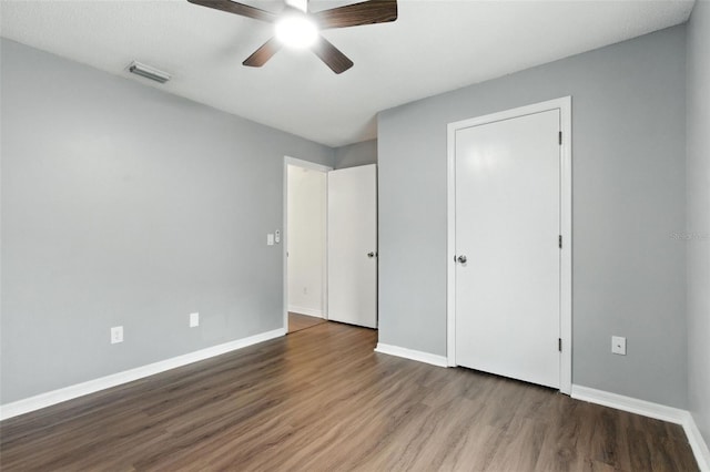 669 Whitetail Loop, Apopka, FL 32703 - unfurnished bedroom featuring wood finished floors and a ceiling fan