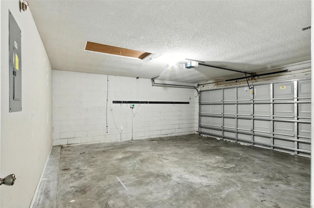 669 Whitetail Loop, Apopka, FL 32703 - garage featuring a garage door opener, concrete block wall, and electric panel