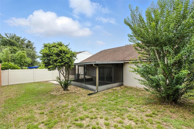 669 Whitetail Loop, Apopka, FL 32703 - fenced backyard with a sunroom
