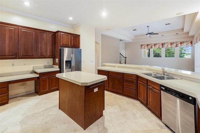 2317 Warren Woods Dr, Orlando, FL 32835 - kitchen with appliances with stainless steel finishes, ceiling fan, a kitchen island, light countertops, and arched walkways