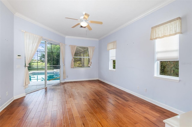 2317 Warren Woods Dr, Orlando, FL 32835 - spare room featuring wood finished floors, ornamental molding, and a ceiling fan