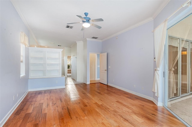 2317 Warren Woods Dr, Orlando, FL 32835 - spare room featuring a ceiling fan, crown molding, and light wood finished floors