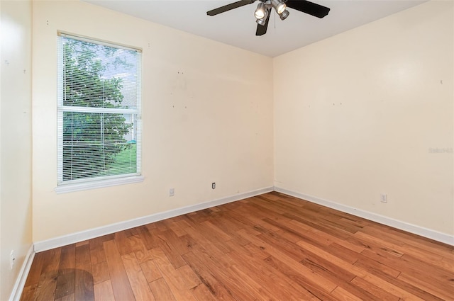 2317 Warren Woods Dr, Orlando, FL 32835 - spare room with healthy amount of natural light, light wood-style flooring, and a ceiling fan