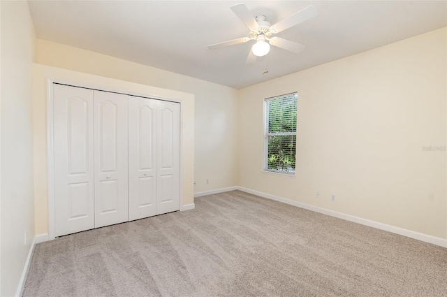 2317 Warren Woods Dr, Orlando, FL 32835 - unfurnished bedroom featuring carpet, a closet, and ceiling fan