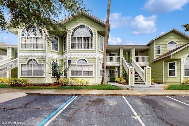 3151 Britannia Blvd Unit A, Kissimmee, FL 34747 - view of property featuring uncovered parking and stairs