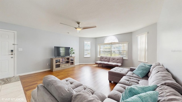 3151 Britannia Blvd Unit A, Kissimmee, FL 34747 - living area featuring wood finished floors and a ceiling fan