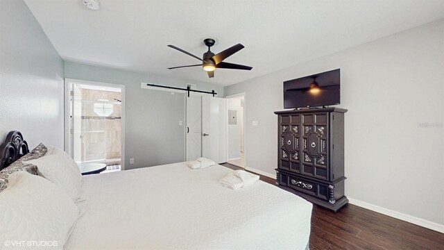 3151 Britannia Blvd Unit A, Kissimmee, FL 34747 - bedroom with dark wood-style floors, a barn door, ceiling fan, and ensuite bathroom
