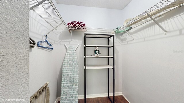 3151 Britannia Blvd Unit A, Kissimmee, FL 34747 - spacious closet with dark wood-style floors and a heating unit
