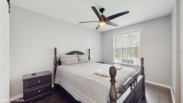3151 Britannia Blvd Unit A, Kissimmee, FL 34747 - bedroom featuring dark wood-style flooring and a ceiling fan