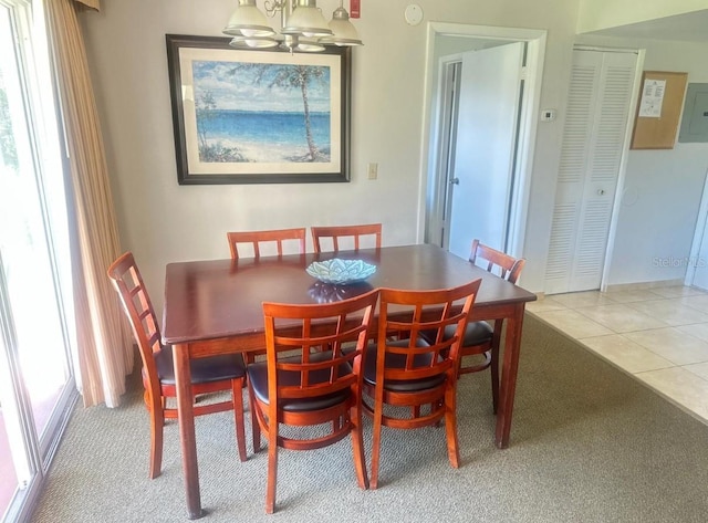 6336 Parc Corniche Dr, Orlando, FL 32821 - dining space with a chandelier and carpet floors