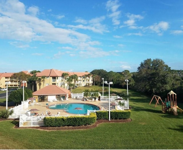6336 Parc Corniche Dr, Orlando, FL 32821 - community pool featuring a patio area
