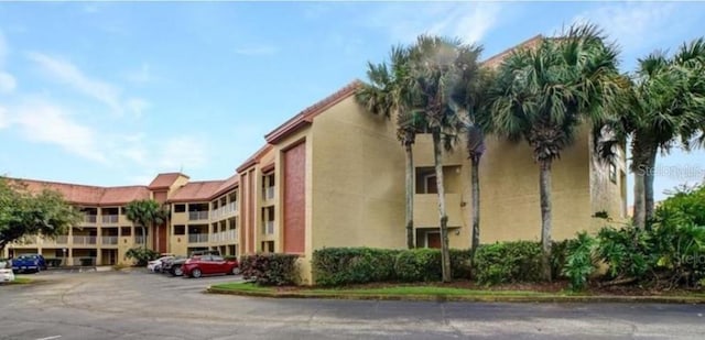 6336 Parc Corniche Dr, Orlando, FL 32821 - view of property with uncovered parking