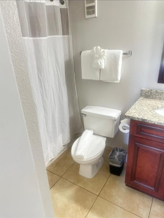 6336 Parc Corniche Dr, Orlando, FL 32821 - bathroom with vanity, a shower with shower curtain, and tile patterned floors