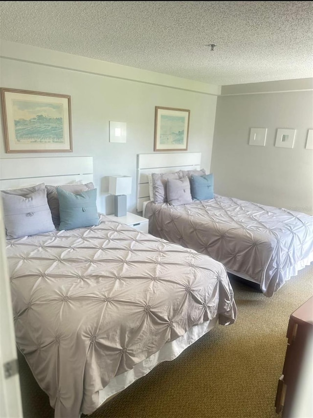6336 Parc Corniche Dr, Orlando, FL 32821 - carpeted bedroom featuring a textured ceiling