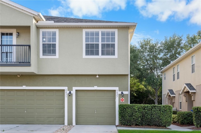 4027 Pemberly Pines Cir, Saint Cloud, FL 34769 - view of front of home with a garage, stucco siding, and concrete driveway
