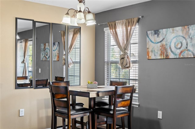 4027 Pemberly Pines Cir, Saint Cloud, FL 34769 - dining area with a chandelier and healthy amount of natural light
