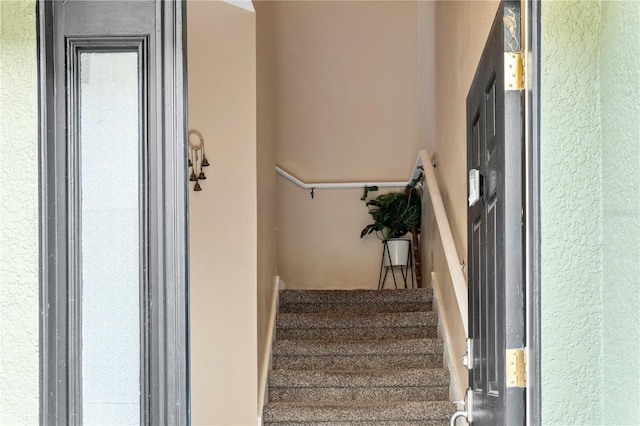 4027 Pemberly Pines Cir, Saint Cloud, FL 34769 - staircase featuring a textured wall