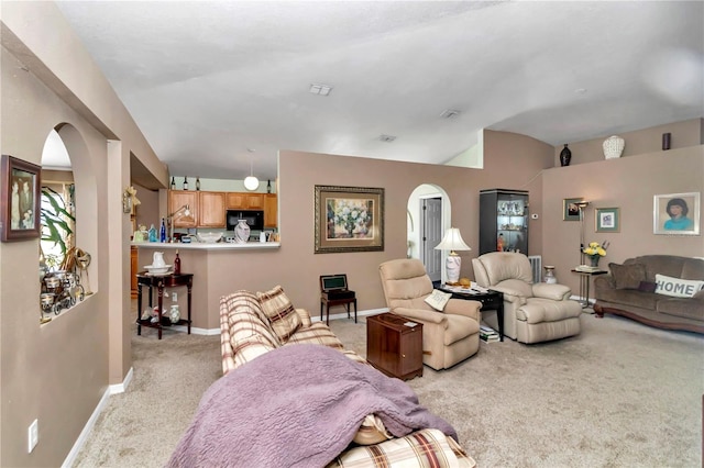 153 Juniper Run, Ocala, FL 34480 - living area with arched walkways, light colored carpet, and lofted ceiling