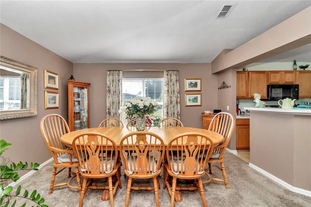 153 Juniper Run, Ocala, FL 34480 - dining room featuring baseboards and light carpet