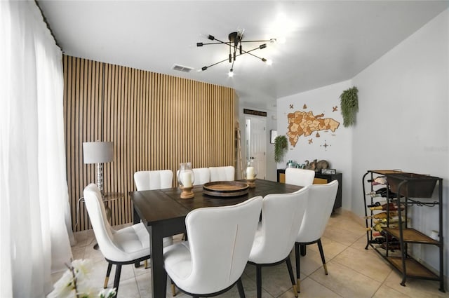 12419 Sion Ct, Orlando, FL 32824 - dining room with a chandelier and light tile patterned floors