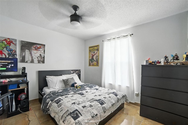 12419 Sion Ct, Orlando, FL 32824 - bedroom with light tile patterned flooring, a ceiling fan, and a textured ceiling